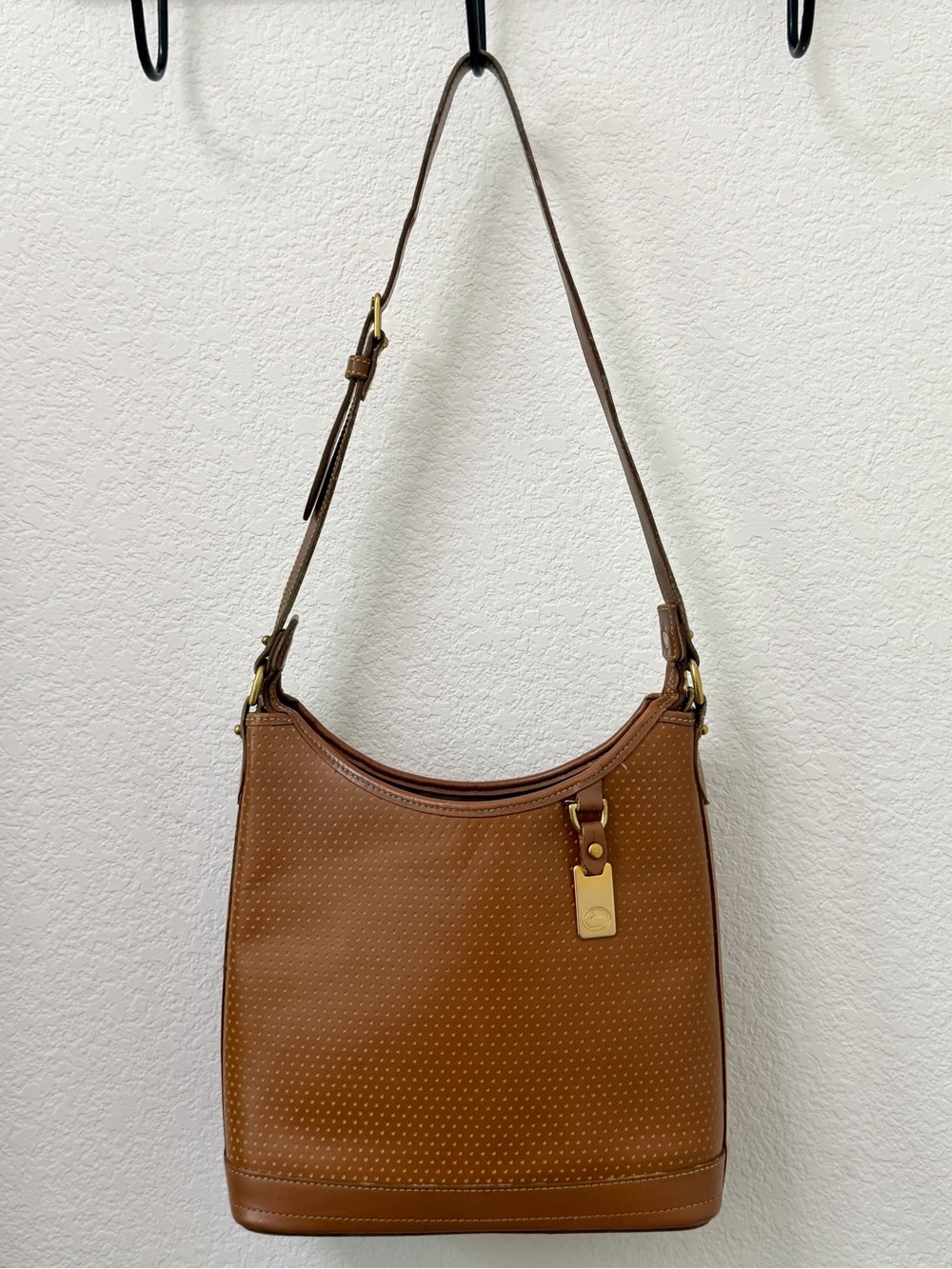 Dooney and Bourke Cabriolet Perforated light brown Leather Vintage Hobo Bag